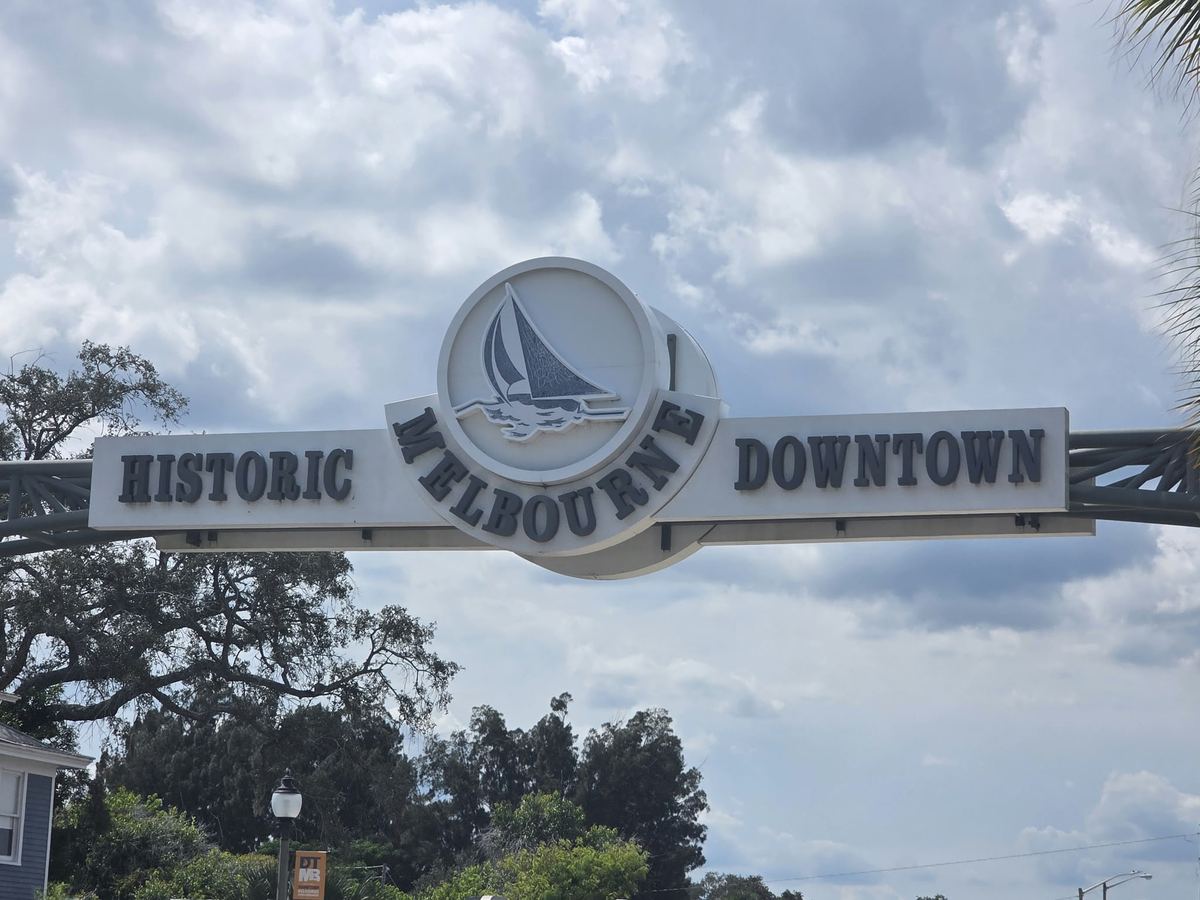 The Historic Downtown Melbourne sign arching over the street in Melbourne, Florida